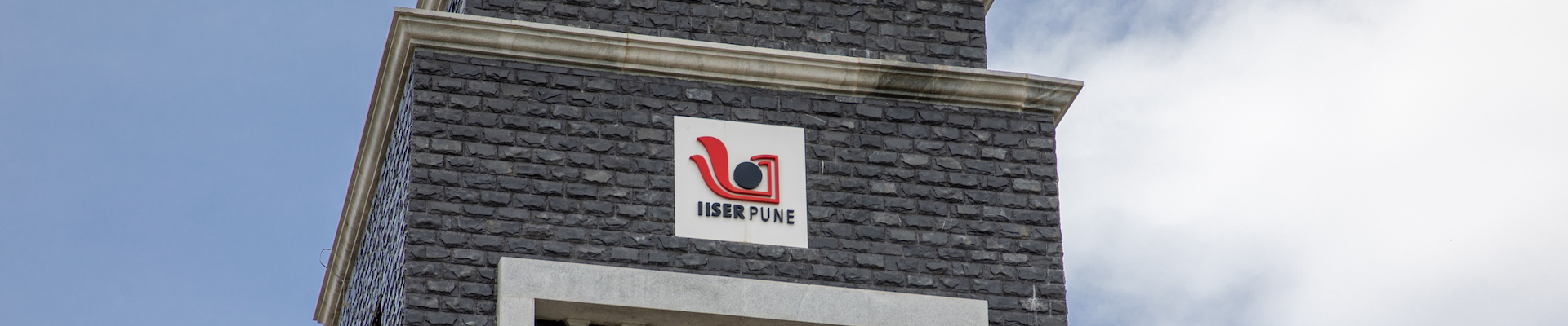The top portion of the campus entrance gate showing IISER Pune logo